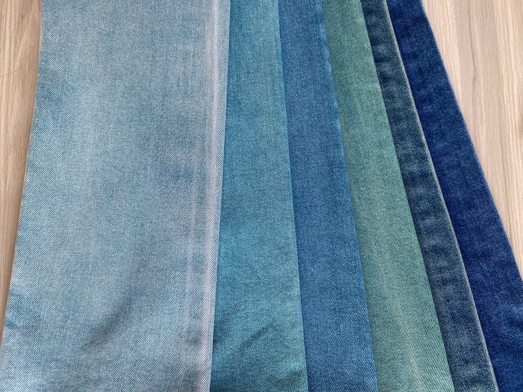 Denim fabric options arranged for selection at ZLDENIM.